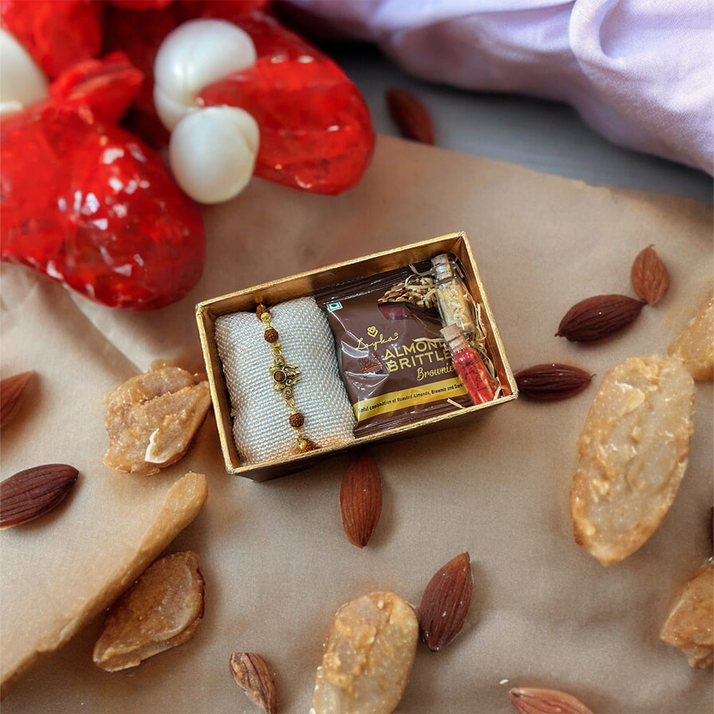 Auspicious Rudraksha Rakhi With Roli Chawal & Almond Brittle Brownie