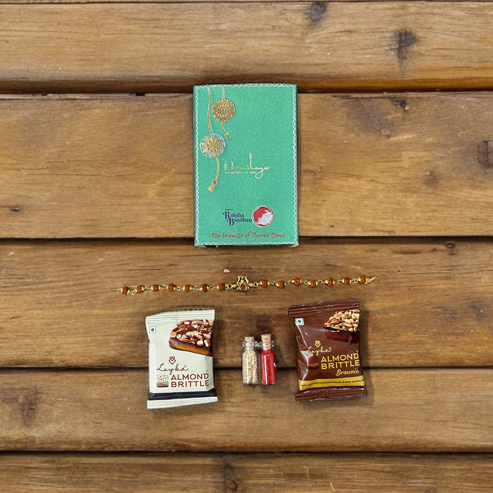 Auspicious Rudraksha Rakhi With Roli Chawal & Almond Brittle Brownie